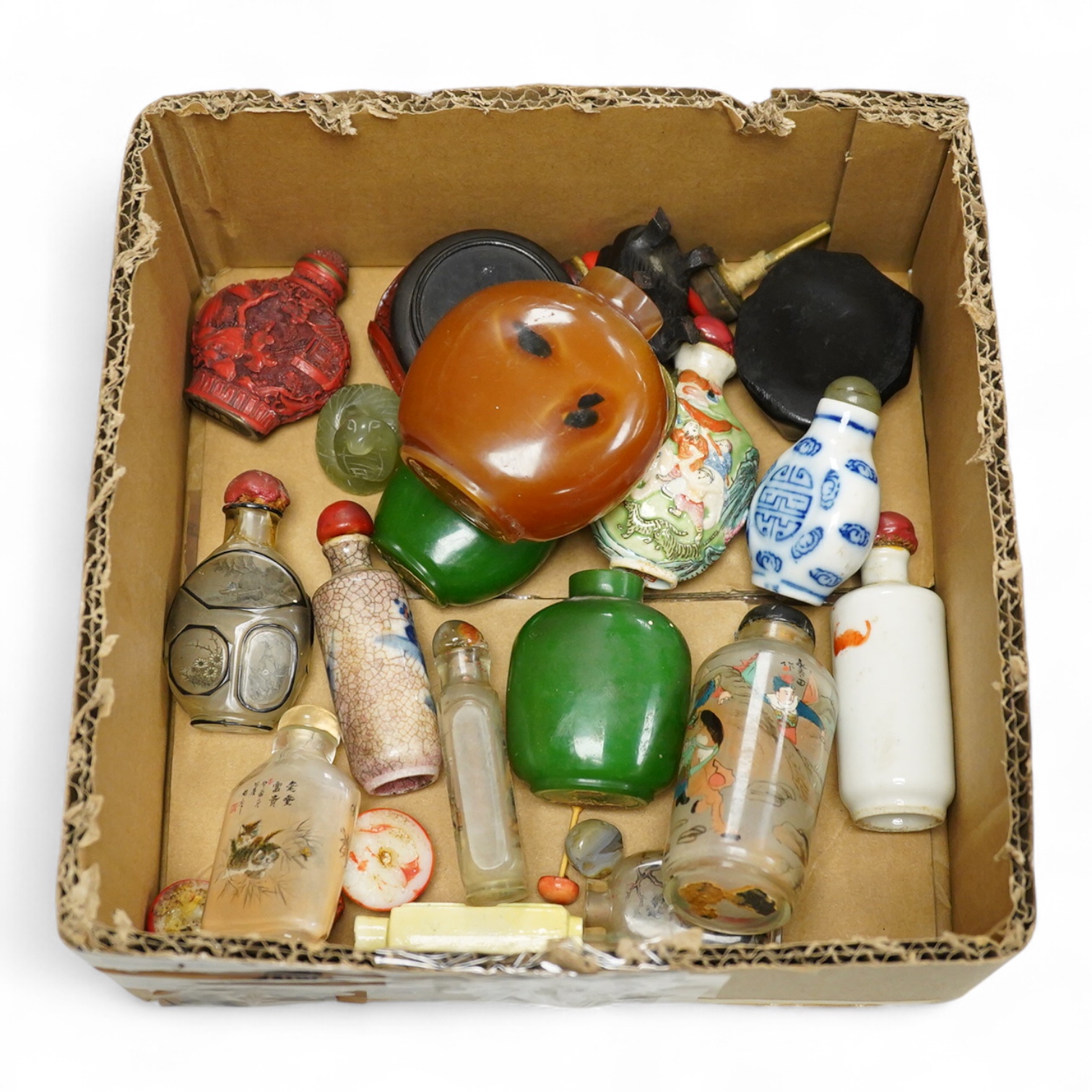 A small collection of Chinese snuff bottles, 19th century and later to include reverse glass painted examples and cinnabar lacquered examples, largest 9.5cm high